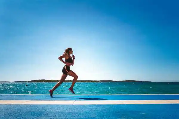 Woman running showing strong leg muscle Berkshire